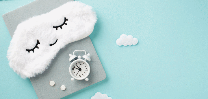 diary with alarm clock and sleeping clouds